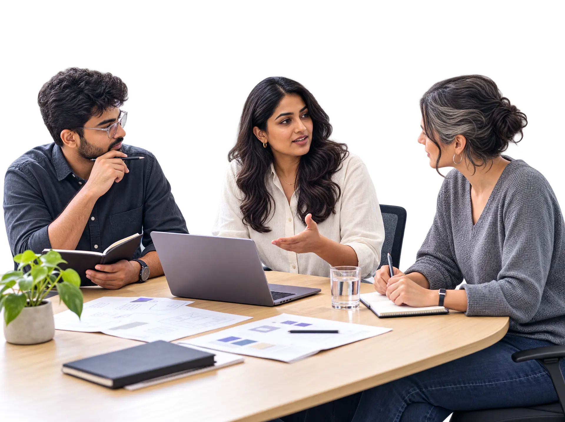 Professionals discussing a project together in a bright studio